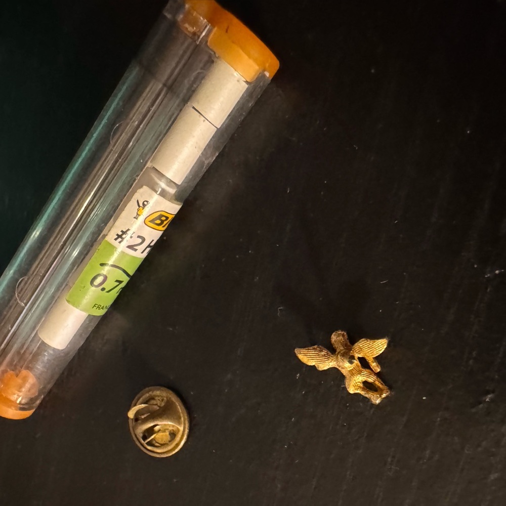 Gold colored baby angel pin
